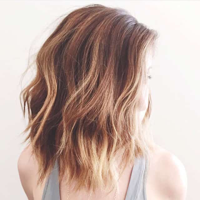 Messy lob with deep side part