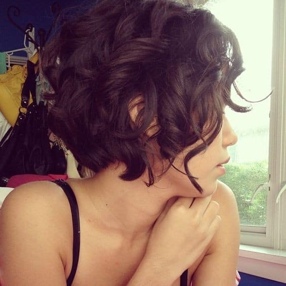 Layered short curly pixie hairstyle for women