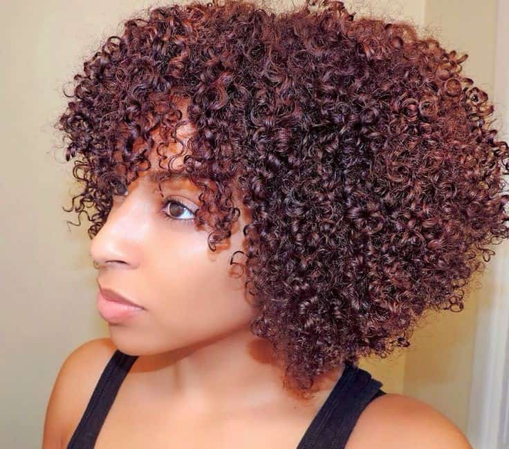 Big and curly copper-colored hair