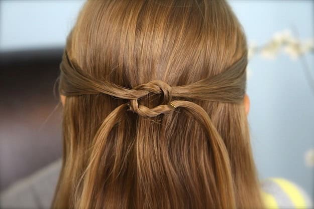 5 minutes hairstyles for long hair: The Knotted Pullback