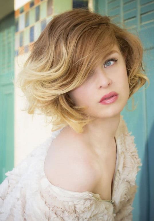 Light brown and buttery blonde curly ombre bob