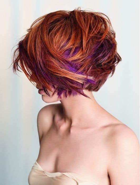 Long layered red bob with purple streaks