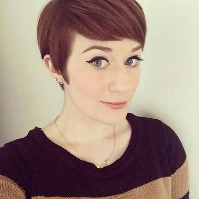 Brown pixie with side part and full bangs