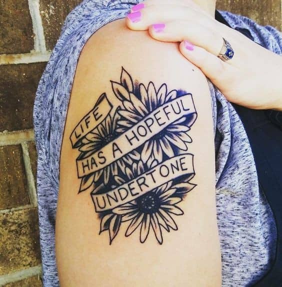 Flowers With Quotes Design on the Arm