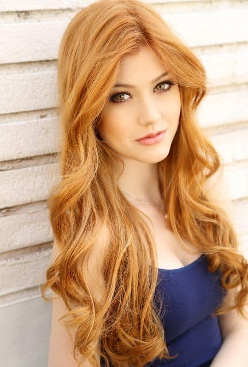 Long and curly strawberry blonde hair