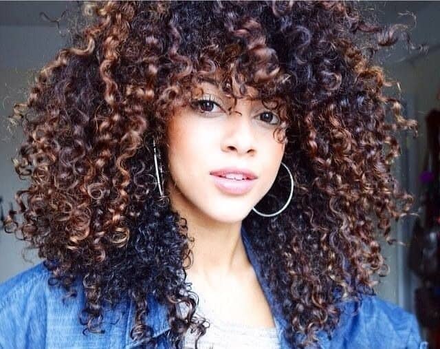 Big and curly hair with bangs