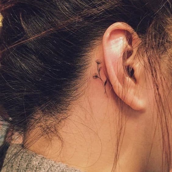 Tiny Flowers Tattooed Behind the Ear