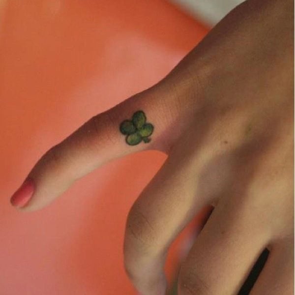 Tiny Clover Tattoo on the Finger