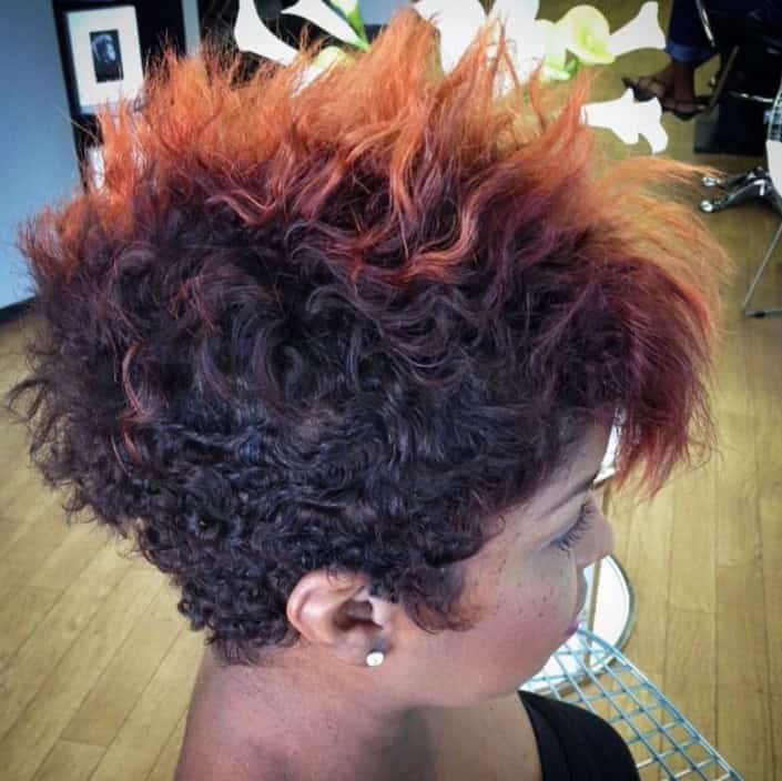 Curly and wavy Mohawk pixie with orange top