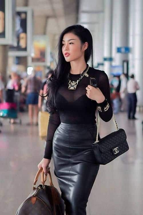 Sheer black top, black leather pencil skirt and black bra