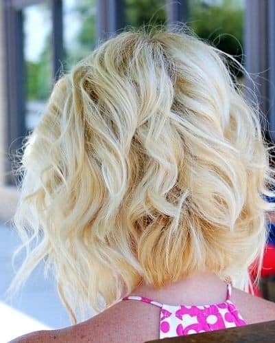 Platinum and buttery blonde curly bob for thick hair