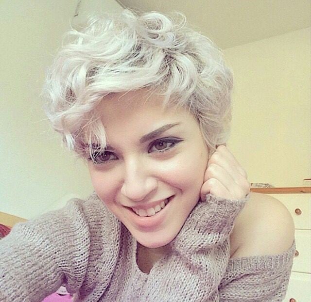 Wavy platinum pixie with natural roots