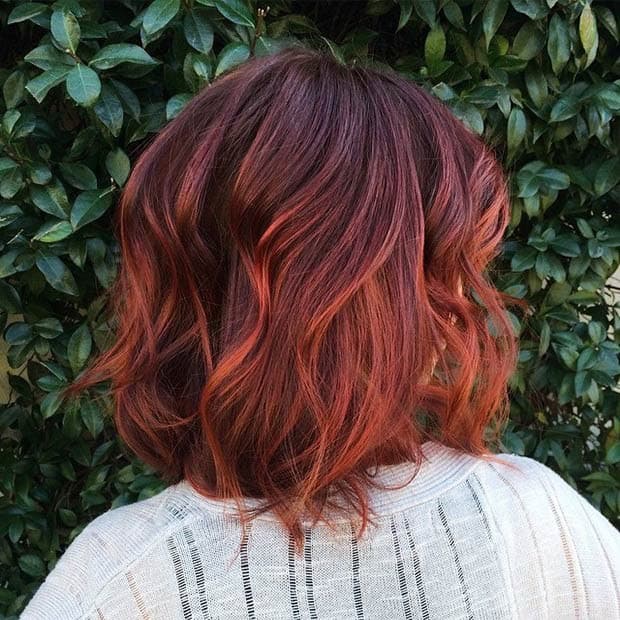 Dark brown, copper and red ombre bob for wavy hair