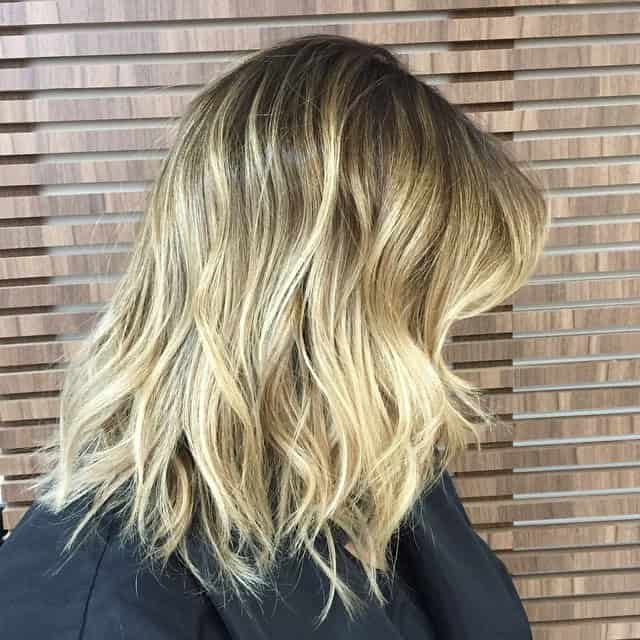 Long and wavy lob with bright blonde ombre