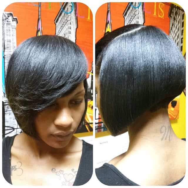 Angled bob with deep side part and feathered side-swept bangs