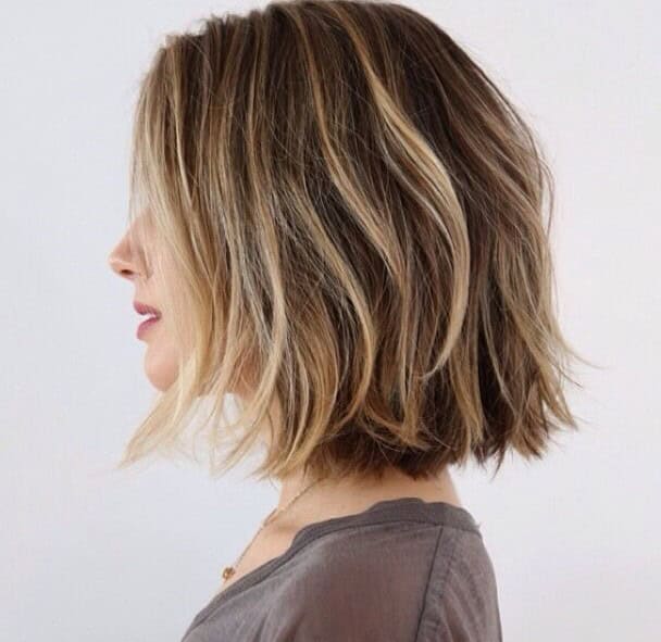 Choppy bob with”barely there” waves with highlighted front and side part