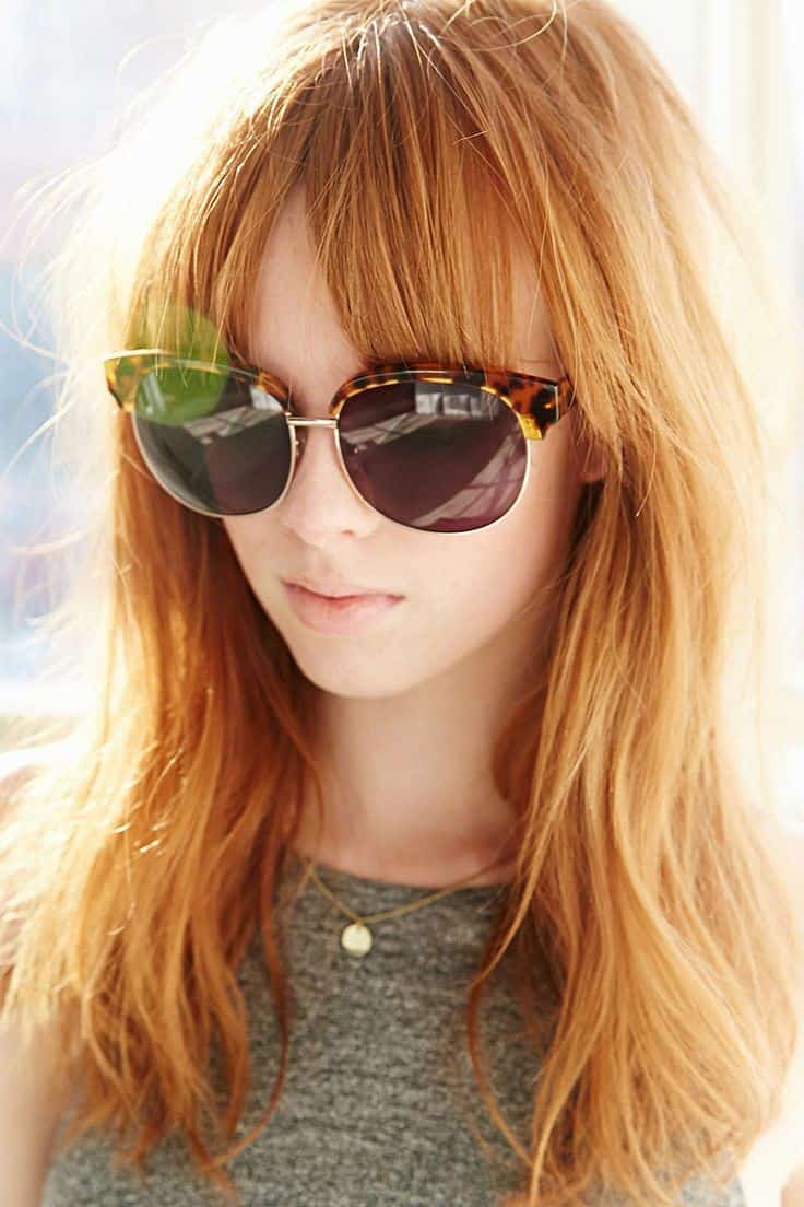 Long strawberry blonde hair with bangs