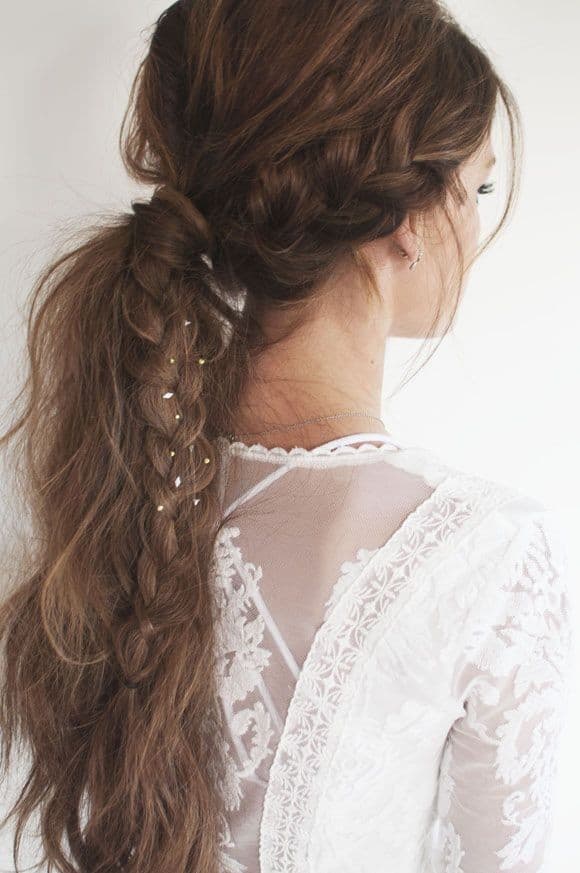 Tousled side braid ponytail