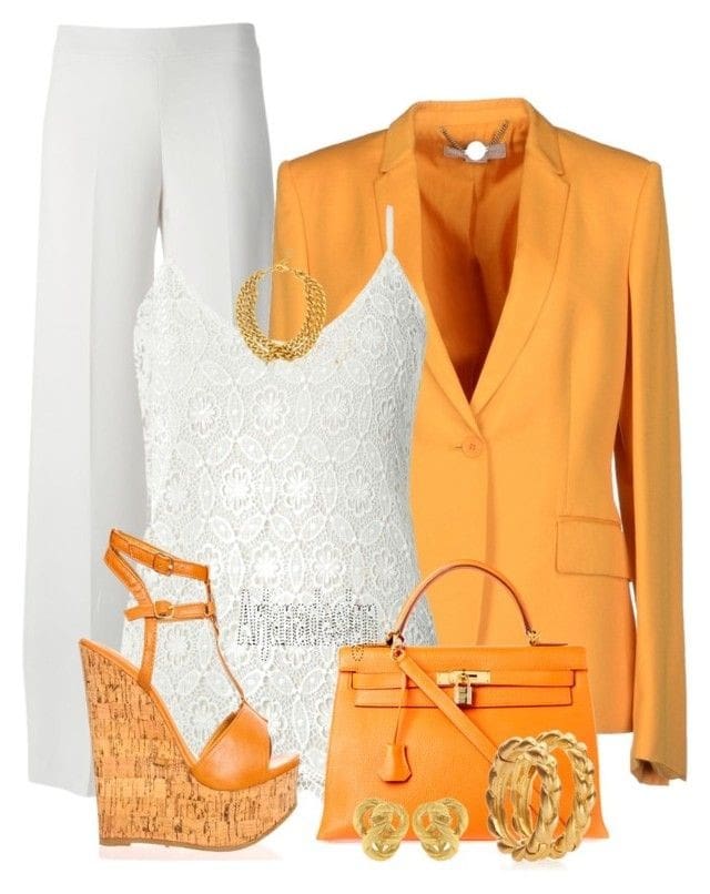 White flare pants with matching lace tank and orange blazer