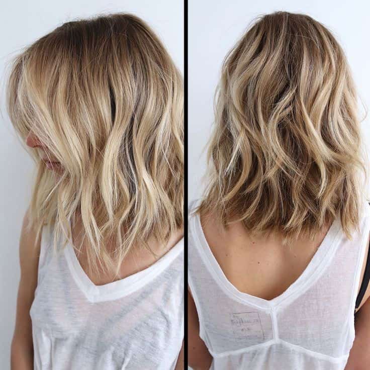 Platinum highlighted wavy lob with long layers for thick hair