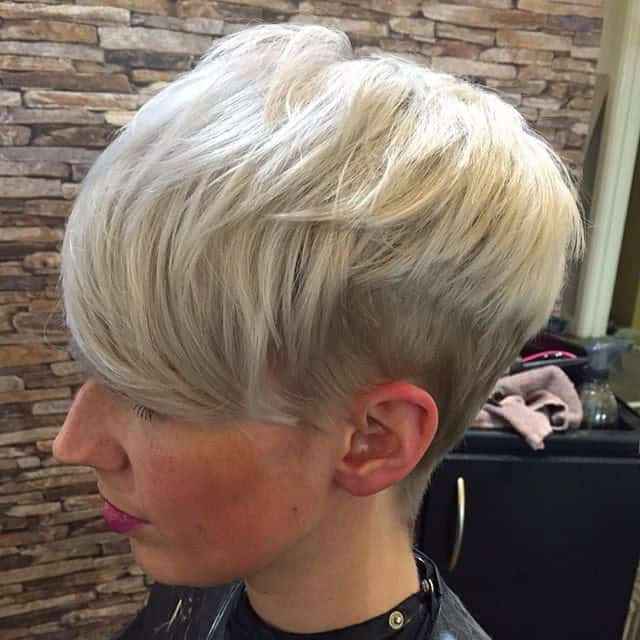 Platinum pixie with shaved sides and longer bangs