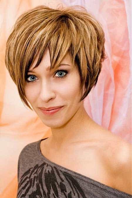 Short brown A-line bob with caramel highlights