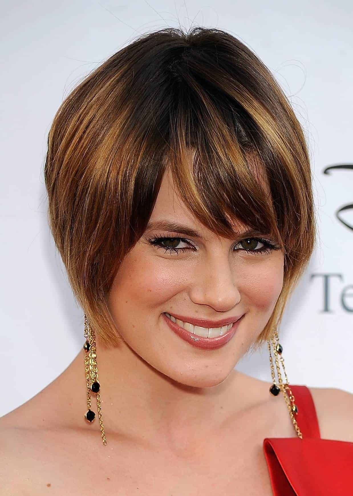 Short A-line cut with bangs and chunks of caramel color