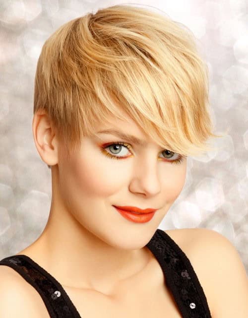 Buttery blonde pixie cut with flipped bangs