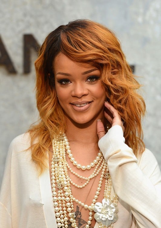 Rihanna Long Burnt Red Hairstyle – long black to brown wavy hairstyle with bangs