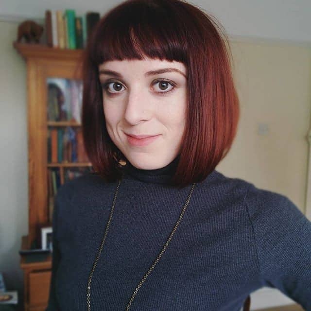 Beneath the chin copper-color blunt bob with blunt bangs