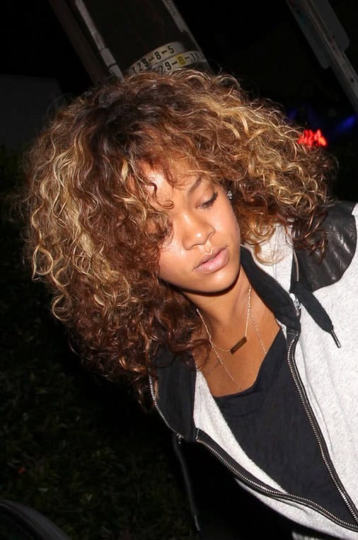 Rihanna Curly Hairstyles  – cool highlighted medium curly hairstyle for black women