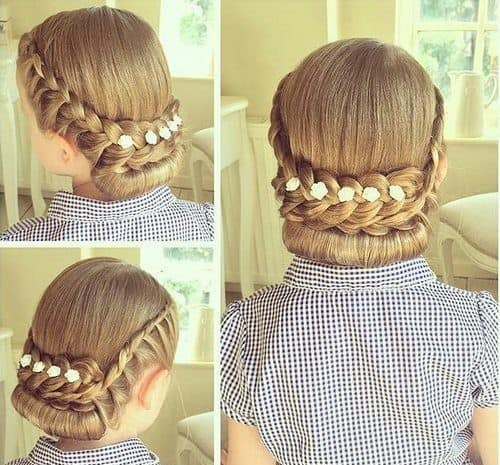 Low braided “up tuck” with small flowers