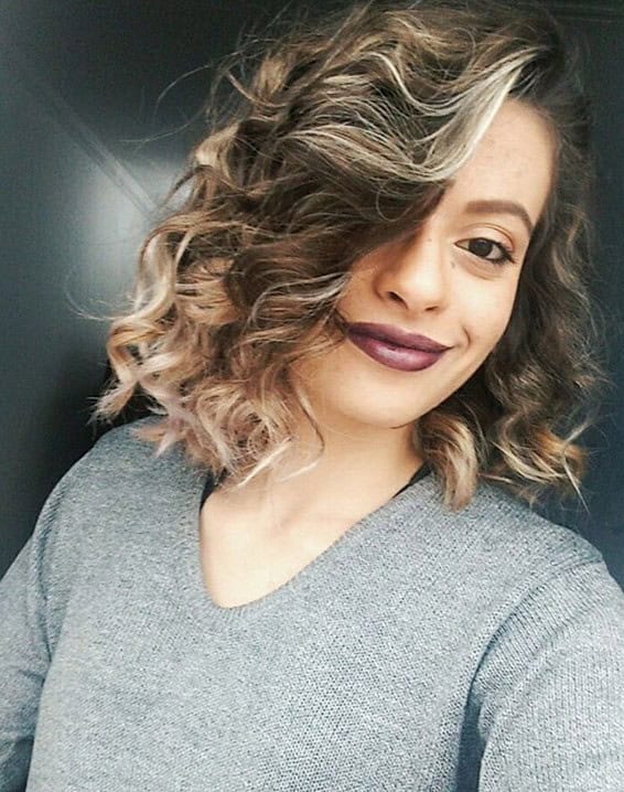 Curly messy lob with platinum highlights