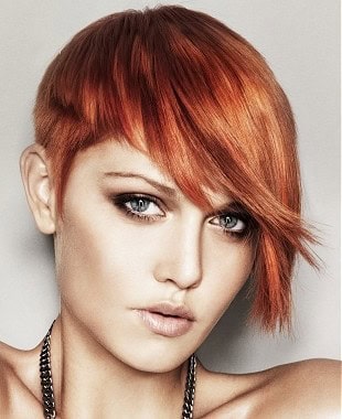 Bright red asymmetrical short cut for thick hair