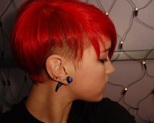 Partly shaved short red pixie