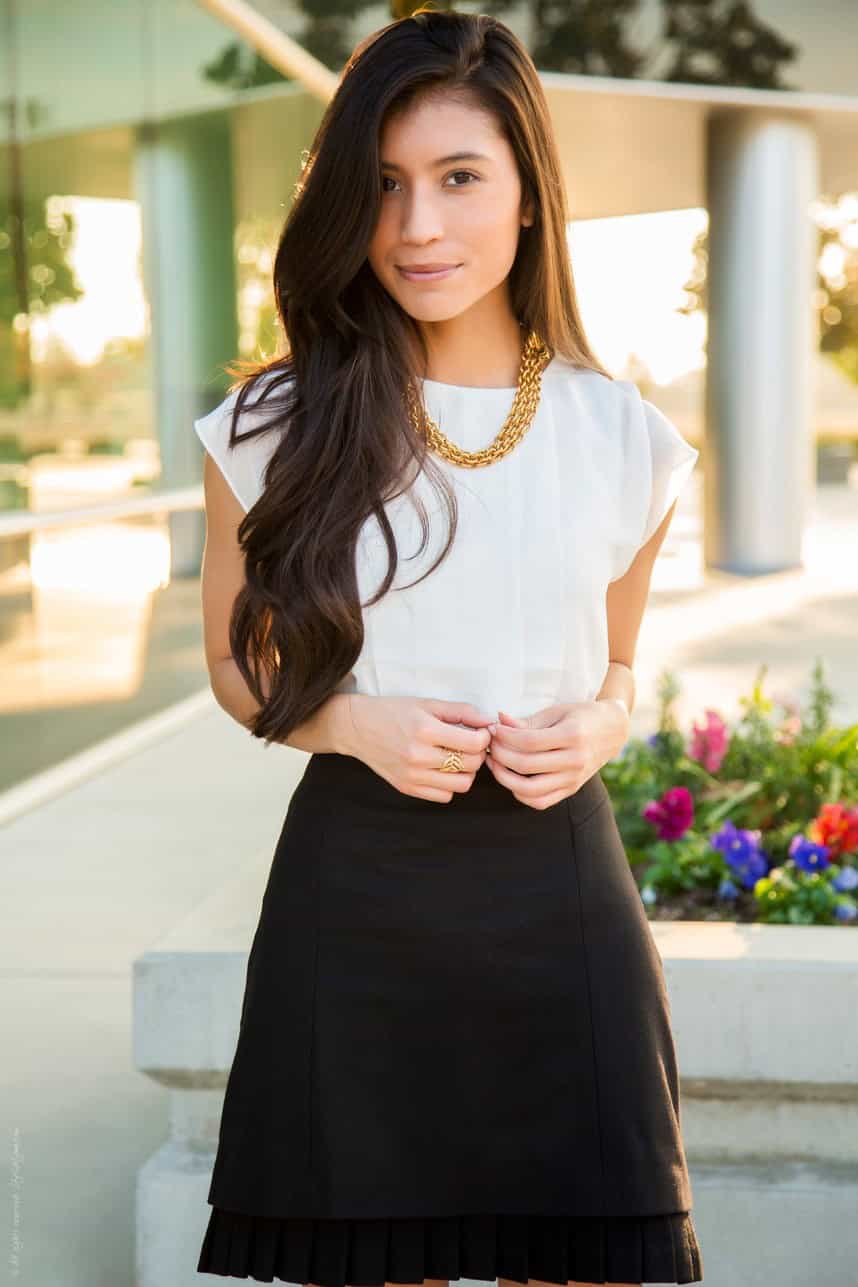 White top with a black flare skirt