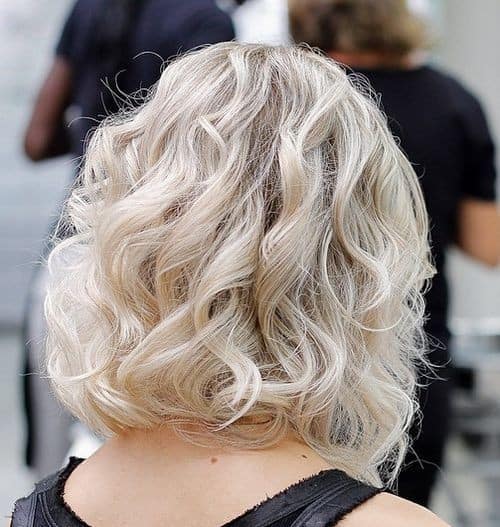 Tousled White Blonde Locks – Chin Length Soft Wavy Bob Cut