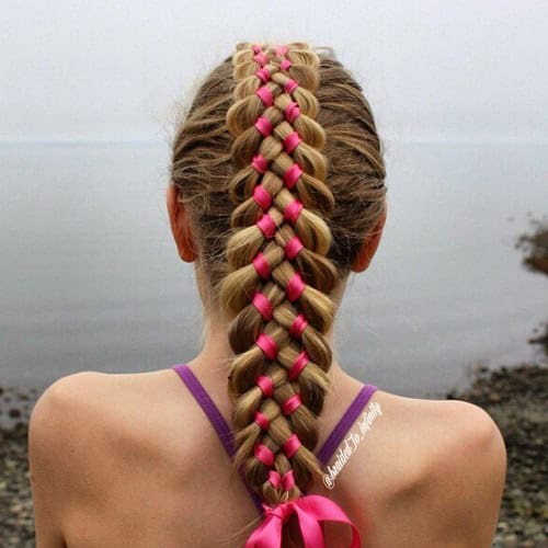 Long braid intertwined with ribbon