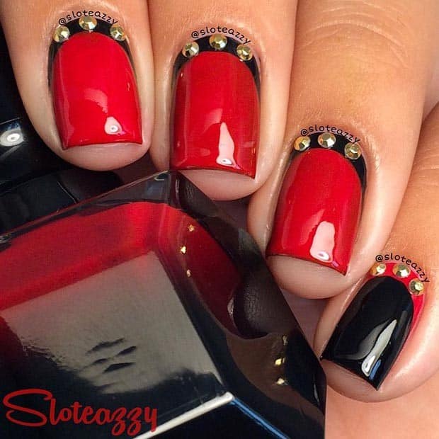 Black and Red Nail Design with Gold Details