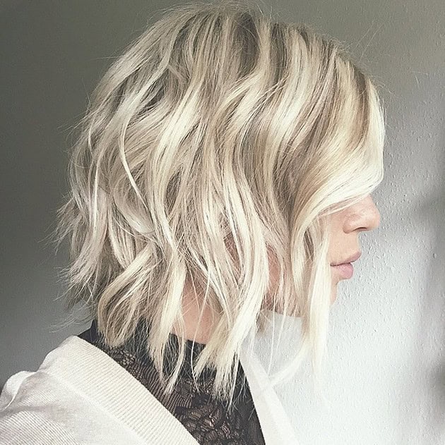 Wavy medium length bob with side-swept bangs