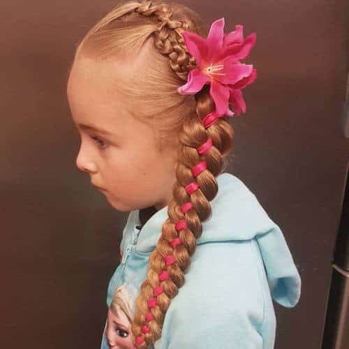 Side braid with ribbon and flowers